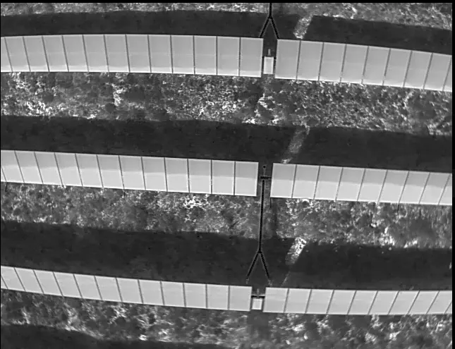 Back-panel reflection between PV rows